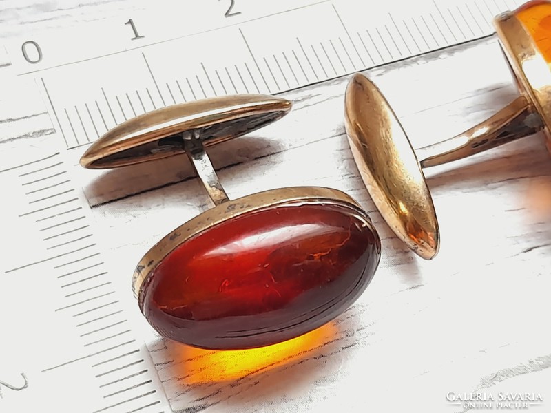 Amber cufflink, marked