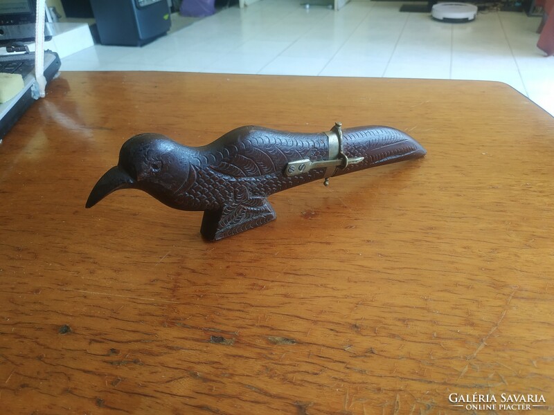 Retro carved bird figurine with knife