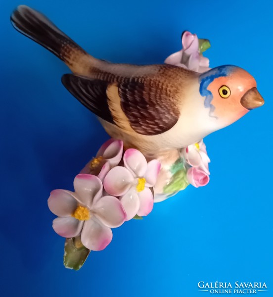 Herend bird on a flowering branch