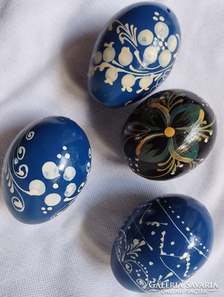 Four wooden hand-painted eggs