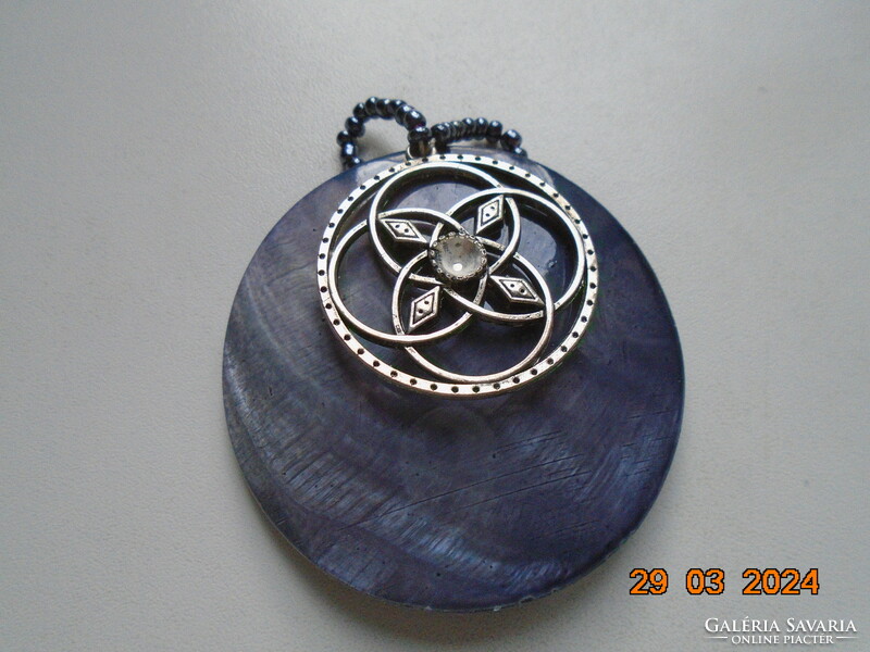 Shell and silver-plated Celtic pendant strung together, with a small metallic blue pearl hook