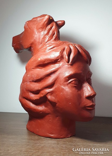 Terracotta statue of a woman with a horse