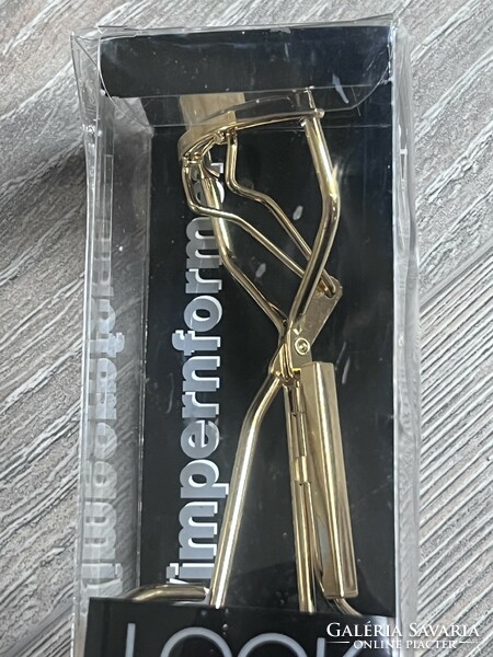 Eyelash curler, in unopened packaging, gold color