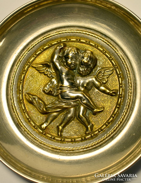 Metal bowl with decorative putty