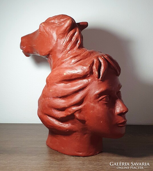 Terracotta statue of a woman with a horse