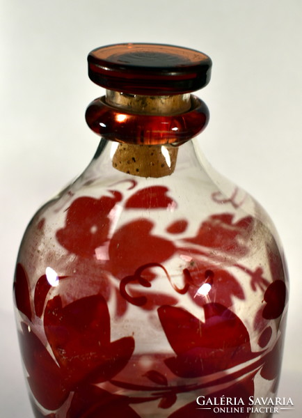 Antique crimson stained glass bottle with cork