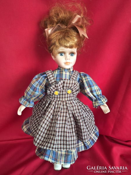 Porcelain doll, combable, dressable, with stand