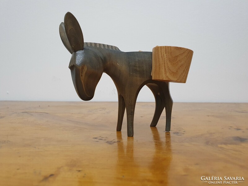 Carved donkey carrying water