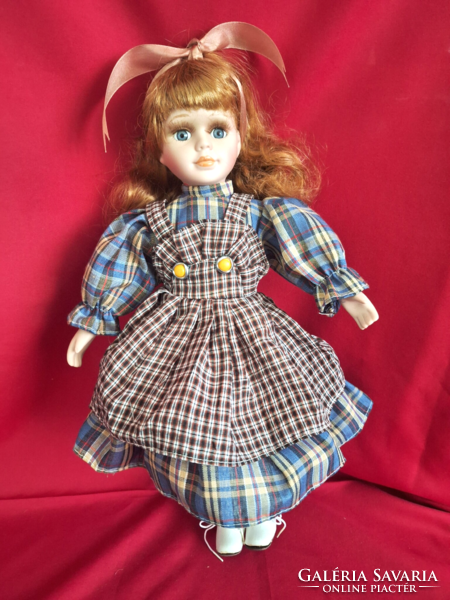 Porcelain doll, combable, dressable, with stand