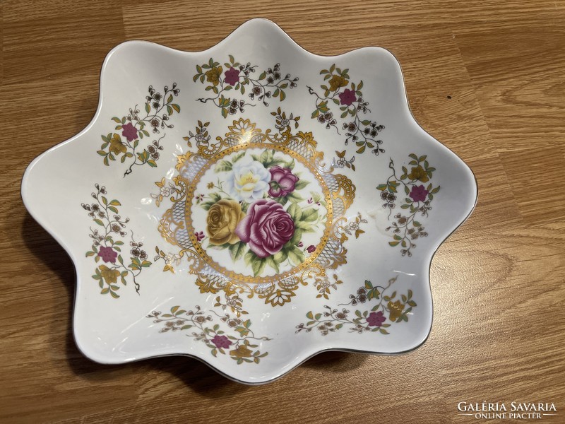 A beautiful rose-colored, richly gilded porcelain dish with a large zigzag edge