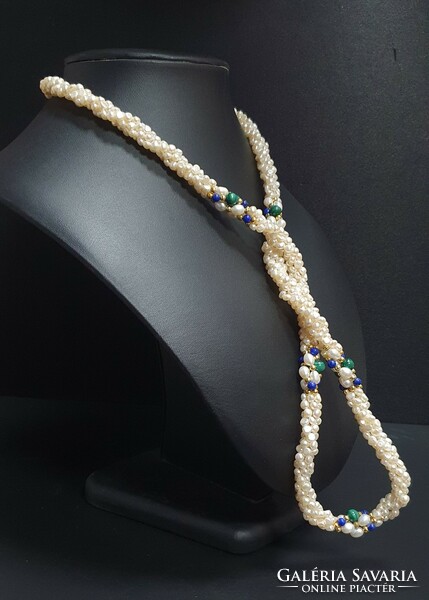 Remarkable baroque 4-row string of pearls with malachite and lapis lazuli decoration. With certification.