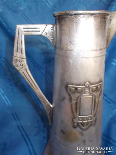 Antique art nouveau metal carafe pouring