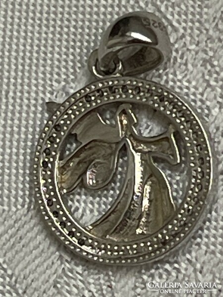 Very nice silver guardian angel pendant surrounded by shock small stones.
