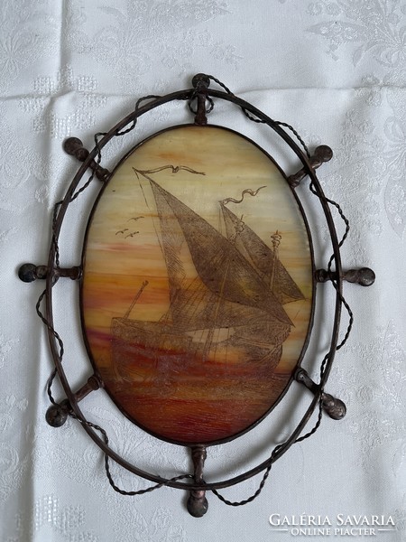 Old glass picture in a solid copper frame.