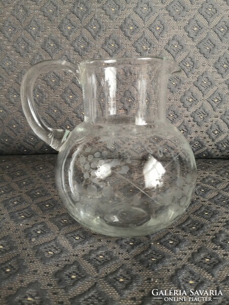 Polished, incised glass jug, grape leaf, carved and tendril garland pattern.