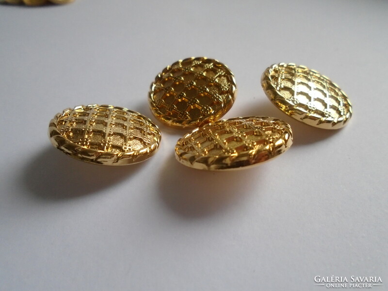 4 Pcs. Gold colored, decorative new metal buttons.