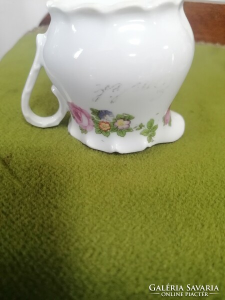 Antique porcelain milk jug with memorial inscription, which is worn