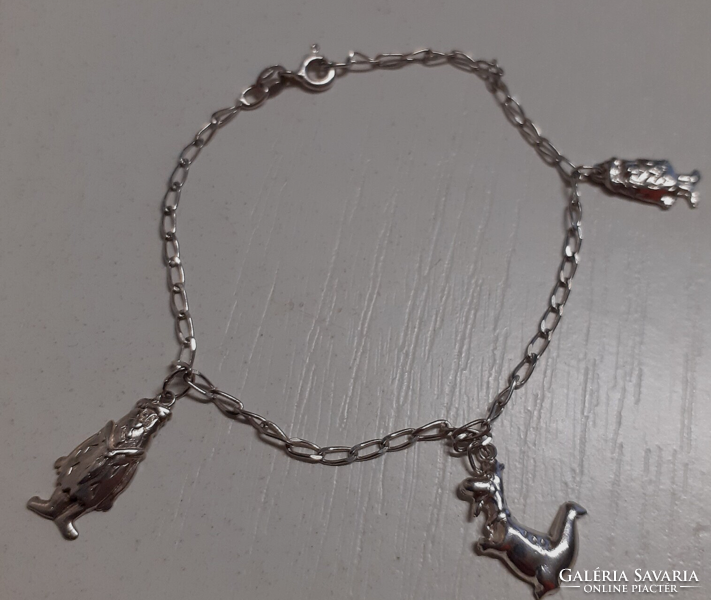 Marked 925 silver women's bracelet with elaborate Fred's lame dino pendants
