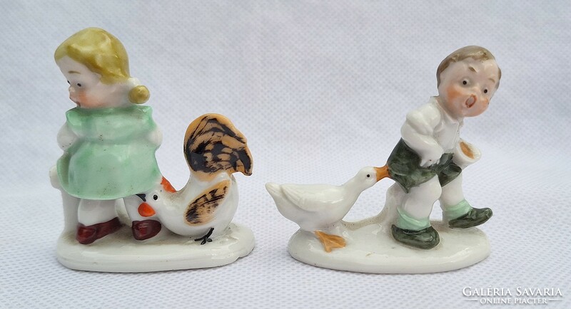 Pair of antique figural hand-painted porcelain statues