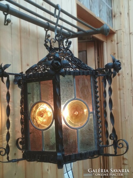 An antique, special design ceiling lamp of a blacksmith's style