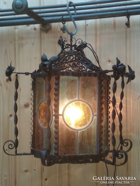 An antique, special design ceiling lamp of a blacksmith's style