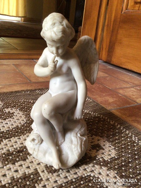 Marked putto statue