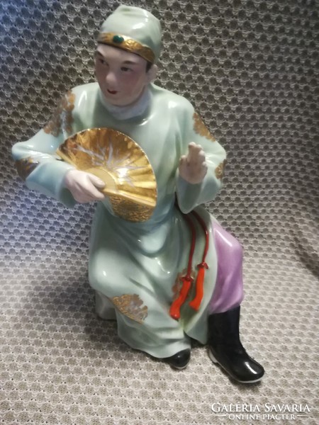 Oriental stoneware male figure with fan
