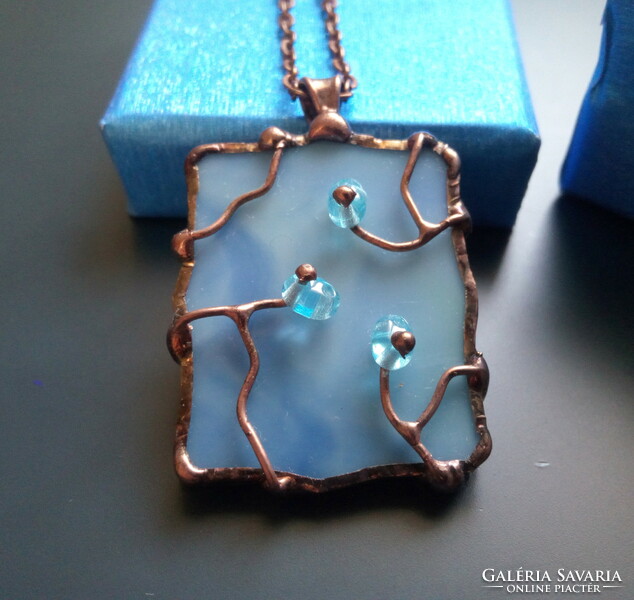 Beautiful light blue glass pendant with sparkling blue pearls