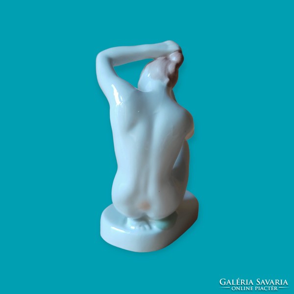 Aquincum porcelain kneeling female nude figure