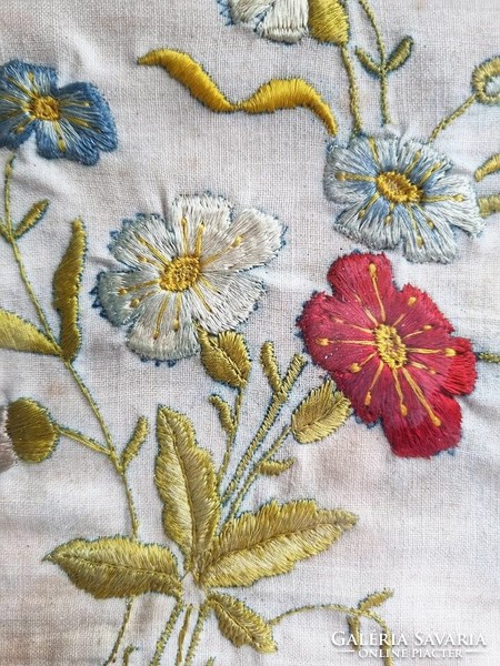 Flowers embroidered on antique canvas in a wooden frame