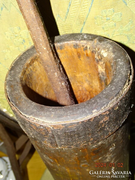 Antique carved wooden mortar with wrought iron pestle