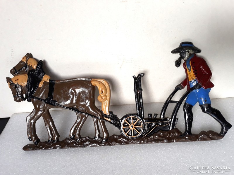 Marked antique cast iron picture with horse plowing scene