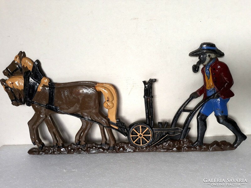 Marked antique cast iron picture with horse plowing scene