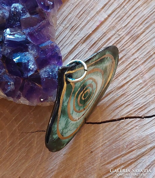Large green fire enamel pendant with a gilded spiral motif from Austria
