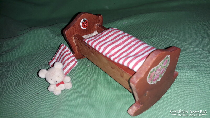 Antique 8 cm dmsz small toy doll in a 10 cm wooden cradle with a teddy bear and bedding as shown in the pictures