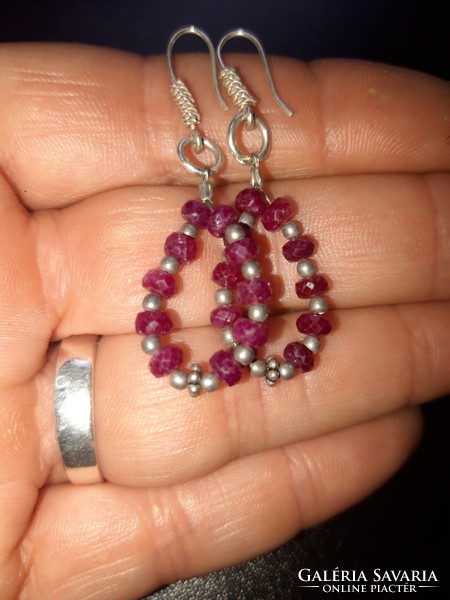 Silver earrings with faceted ruby pearls