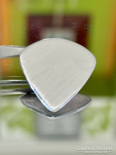 Cool silver guitar pick pendant.