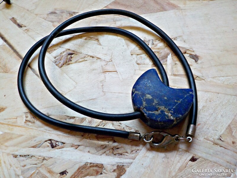 Large polished lapis lazuli mineral rubber on a chain