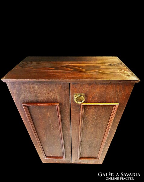 Old brown bathroom cabinets. Lower element and wall cabinet.