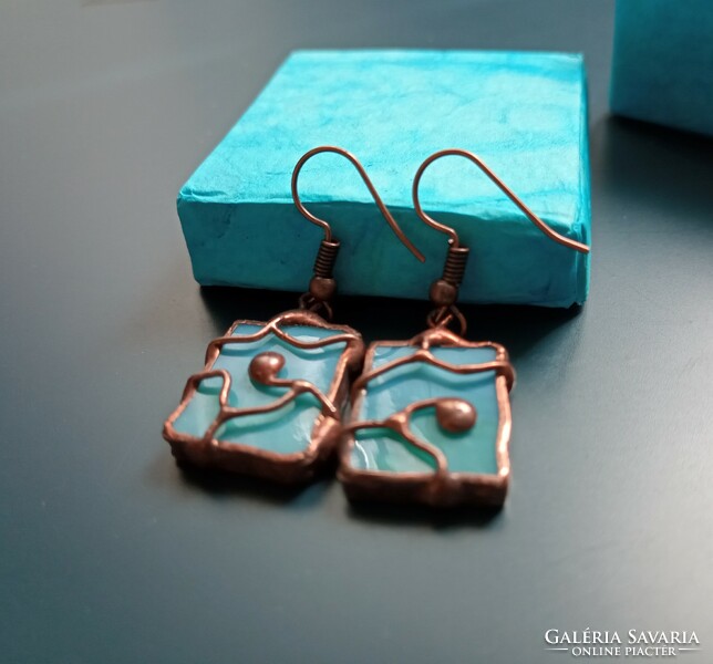 Unique handmade earrings made of light blue glass