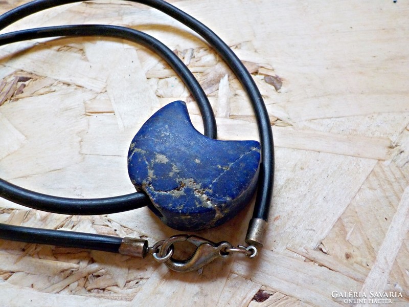 Large polished lapis lazuli mineral rubber on a chain