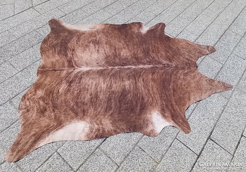 Designer cowhide and fur carpet is negotiable