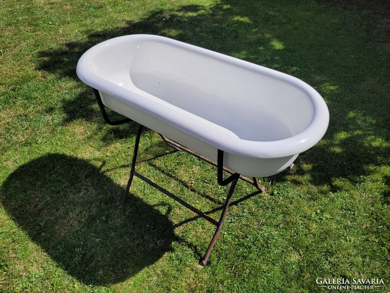 Old vintage enameled lampart in baby bath with enamel bathtub for kids tub with bathtub stand