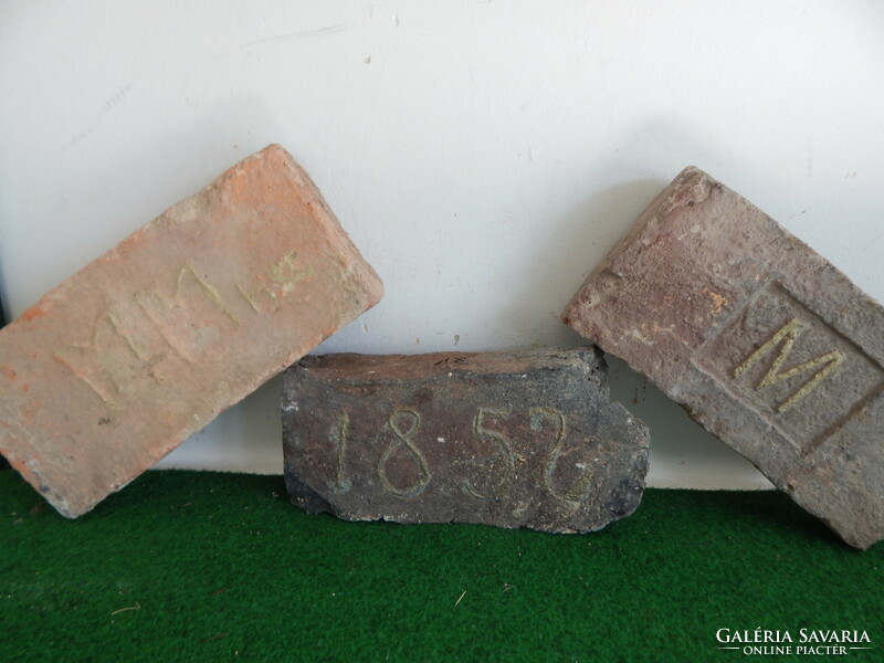 Antique bricks with the year 1852, monogrammed, m, and mm. No. 18.