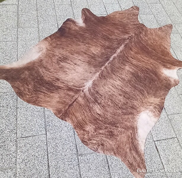 Designer cowhide and fur carpet is negotiable