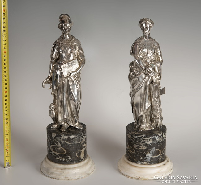 Silver statue of the goddess Artemis on a marble plinth