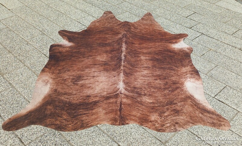 Designer cowhide and fur carpet is negotiable