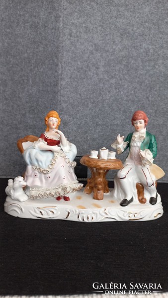 Vintage baroque figures, with porcelain lace on the clothes, a beautiful piece with a lovely atmosphere