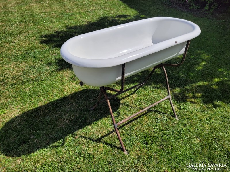 Old vintage enameled lampart in baby bath with enamel bathtub for kids tub with bathtub stand