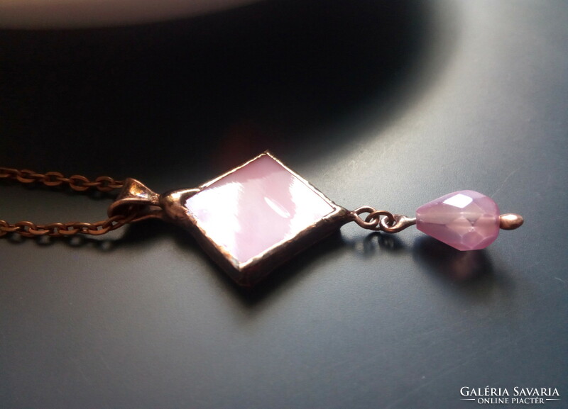 Handmade pink glass pendant with a drop-shaped pearl